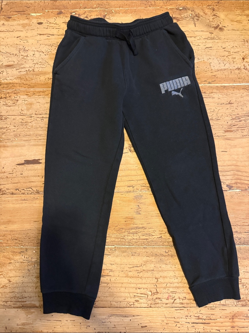 Puma Black Kids Jogger Sweatpants with Logo. Slightly faded but still look great